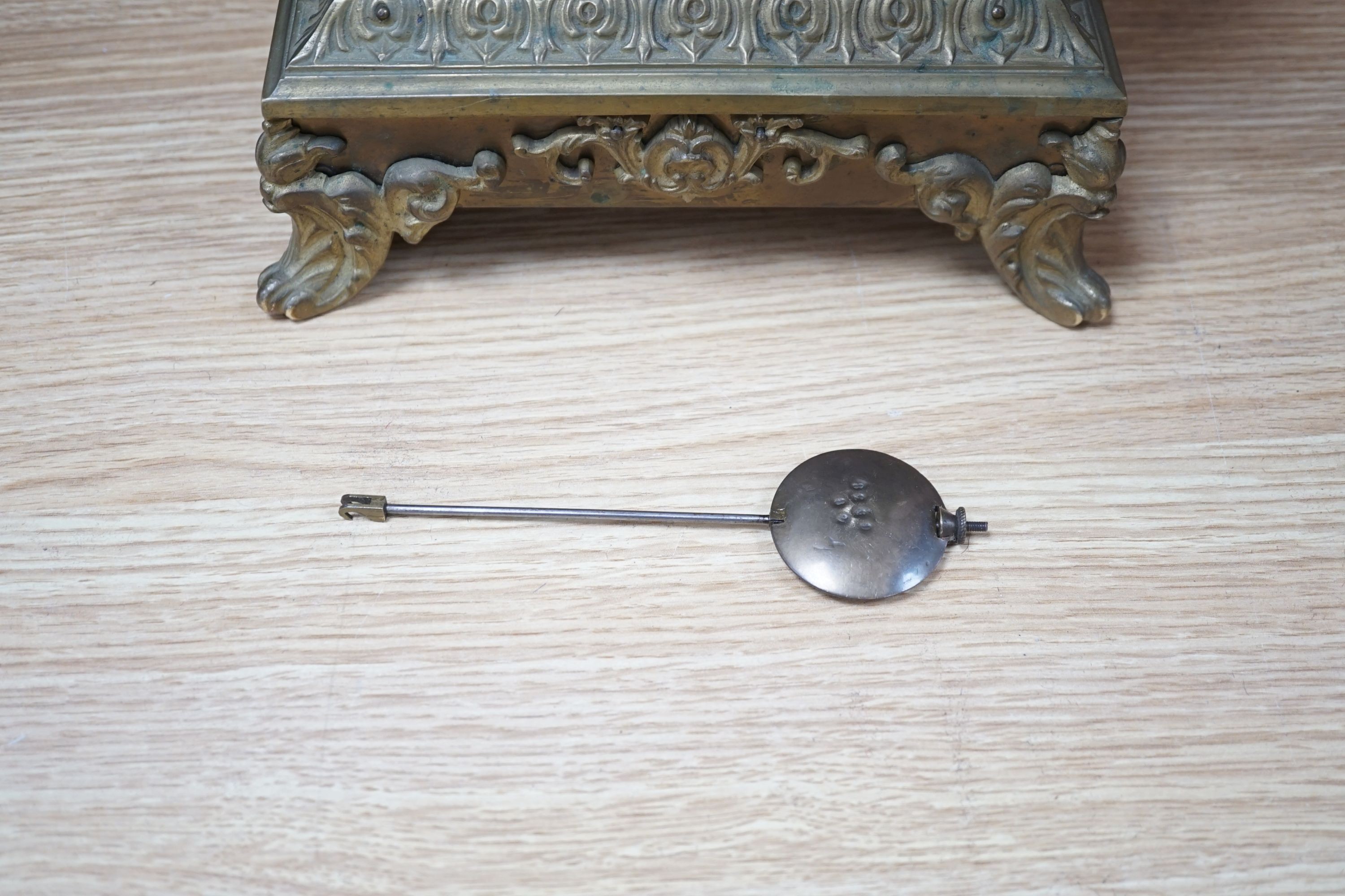 An early 20th century brass mantel clock, 40 cms high.